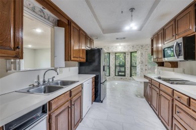 New flooring in living room, kitchen 2 bedrooms and 2 bathrooms on Texas Rangers Golf Club  in Texas - for sale on GolfHomes.com, golf home, golf lot