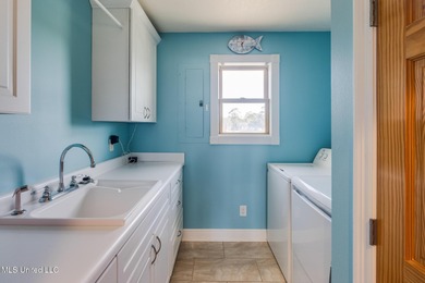 Waterfront 3-bed, 2.5-bath home in Timber Ridge with private on Pass Christian Isles Golf Club in Mississippi - for sale on GolfHomes.com, golf home, golf lot