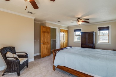 Waterfront 3-bed, 2.5-bath home in Timber Ridge with private on Pass Christian Isles Golf Club in Mississippi - for sale on GolfHomes.com, golf home, golf lot