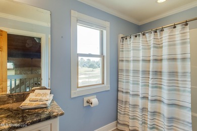 Waterfront 3-bed, 2.5-bath home in Timber Ridge with private on Pass Christian Isles Golf Club in Mississippi - for sale on GolfHomes.com, golf home, golf lot