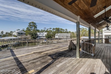 Waterfront 3-bed, 2.5-bath home in Timber Ridge with private on Pass Christian Isles Golf Club in Mississippi - for sale on GolfHomes.com, golf home, golf lot