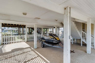 Waterfront 3-bed, 2.5-bath home in Timber Ridge with private on Pass Christian Isles Golf Club in Mississippi - for sale on GolfHomes.com, golf home, golf lot