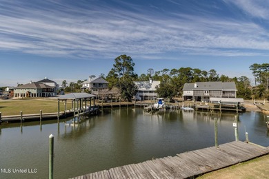Waterfront 3-bed, 2.5-bath home in Timber Ridge with private on Pass Christian Isles Golf Club in Mississippi - for sale on GolfHomes.com, golf home, golf lot