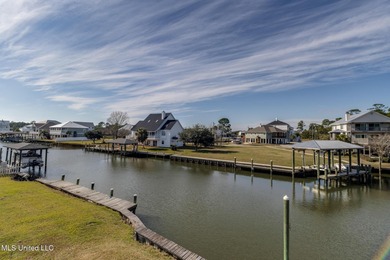 Waterfront 3-bed, 2.5-bath home in Timber Ridge with private on Pass Christian Isles Golf Club in Mississippi - for sale on GolfHomes.com, golf home, golf lot