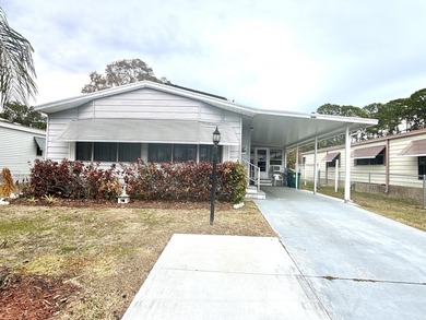 This charming 2BR/2BA home in Barefoot bay, combines comfortable on Barefoot Bay Golf Course in Florida - for sale on GolfHomes.com, golf home, golf lot
