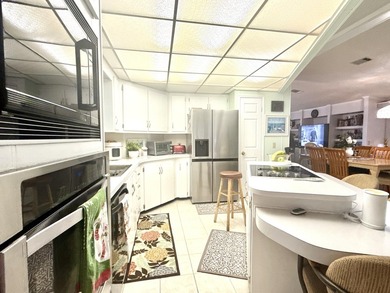 This charming 2BR/2BA home in Barefoot bay, combines comfortable on Barefoot Bay Golf Course in Florida - for sale on GolfHomes.com, golf home, golf lot