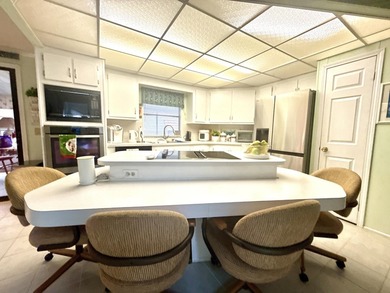 This charming 2BR/2BA home in Barefoot bay, combines comfortable on Barefoot Bay Golf Course in Florida - for sale on GolfHomes.com, golf home, golf lot