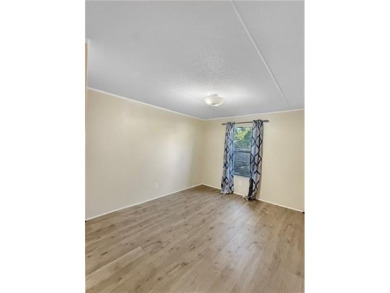 Welcome to this beautifully updated double wide mobile home on Diamondhead Country Club in Mississippi - for sale on GolfHomes.com, golf home, golf lot