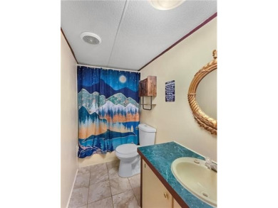 Welcome to this beautifully updated double wide mobile home on Diamondhead Country Club in Mississippi - for sale on GolfHomes.com, golf home, golf lot