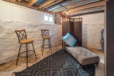 Welcome home to this charming 2-bedroom, 2-bath residence filled on Amsterdam Municipal Golf Course in New York - for sale on GolfHomes.com, golf home, golf lot