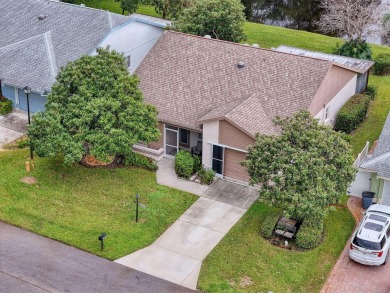 Lovely 2 bedroom home with split bedrooms, vaulted ceilings in on Summertree Golf Course in Florida - for sale on GolfHomes.com, golf home, golf lot