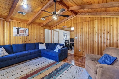Warm, welcoming, and full of character, this log cabin style on De Cordova Bend Country Club in Texas - for sale on GolfHomes.com, golf home, golf lot
