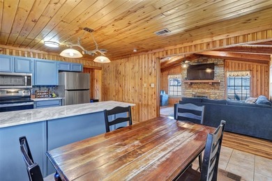 Warm, welcoming, and full of character, this log cabin style on De Cordova Bend Country Club in Texas - for sale on GolfHomes.com, golf home, golf lot