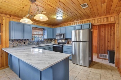 Warm, welcoming, and full of character, this log cabin style on De Cordova Bend Country Club in Texas - for sale on GolfHomes.com, golf home, golf lot