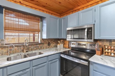 Warm, welcoming, and full of character, this log cabin style on De Cordova Bend Country Club in Texas - for sale on GolfHomes.com, golf home, golf lot