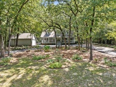 Southern charm meets this 3BR 2BA  Cape Cod style cottage tucked on Holly Lake Ranch Golf Club in Texas - for sale on GolfHomes.com, golf home, golf lot