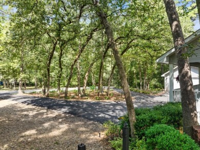 Southern charm meets this 3BR 2BA  Cape Cod style cottage tucked on Holly Lake Ranch Golf Club in Texas - for sale on GolfHomes.com, golf home, golf lot
