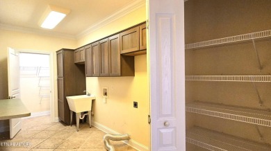 This spacious 3,380 sq ft brick and stone ranch-style home in on Royal Oaks Golf Club in Tennessee - for sale on GolfHomes.com, golf home, golf lot