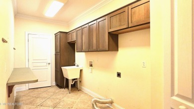 This spacious 3,380 sq ft brick and stone ranch-style home in on Royal Oaks Golf Club in Tennessee - for sale on GolfHomes.com, golf home, golf lot