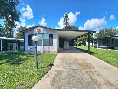 Imagine driving down a beautiful tree-lined street in a secure on Crystal Lake Club in Florida - for sale on GolfHomes.com, golf home, golf lot