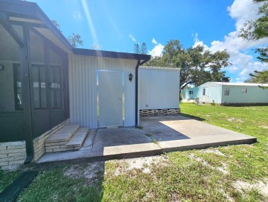 Imagine driving down a beautiful tree-lined street in a secure on Crystal Lake Club in Florida - for sale on GolfHomes.com, golf home, golf lot