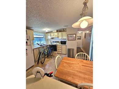 Imagine driving down a beautiful tree-lined street in a secure on Crystal Lake Club in Florida - for sale on GolfHomes.com, golf home, golf lot