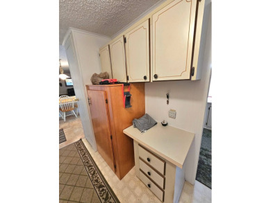 Imagine driving down a beautiful tree-lined street in a secure on Crystal Lake Club in Florida - for sale on GolfHomes.com, golf home, golf lot