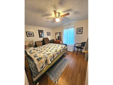 Imagine driving down a beautiful tree-lined street in a secure on Crystal Lake Club in Florida - for sale on GolfHomes.com, golf home, golf lot