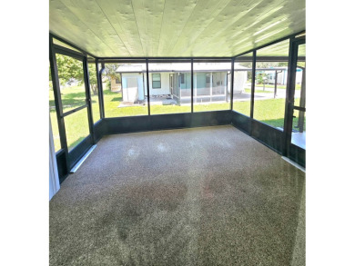 Imagine driving down a beautiful tree-lined street in a secure on Crystal Lake Club in Florida - for sale on GolfHomes.com, golf home, golf lot