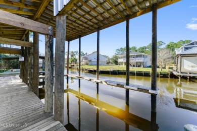 Enjoy this beautiful waterfront lot while planning your dream on Pass Christian Isles Golf Club in Mississippi - for sale on GolfHomes.com, golf home, golf lot