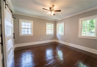 Walk in and welcome home to this Beautifully Renovated Bungalow on Alfred Tup Holmes Golf Course in Georgia - for sale on GolfHomes.com, golf home, golf lot