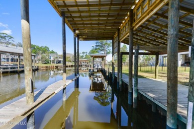 Enjoy this beautiful waterfront lot while planning your dream on Pass Christian Isles Golf Club in Mississippi - for sale on GolfHomes.com, golf home, golf lot