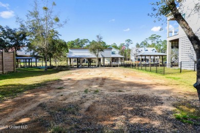Enjoy this beautiful waterfront lot while planning your dream on Pass Christian Isles Golf Club in Mississippi - for sale on GolfHomes.com, golf home, golf lot