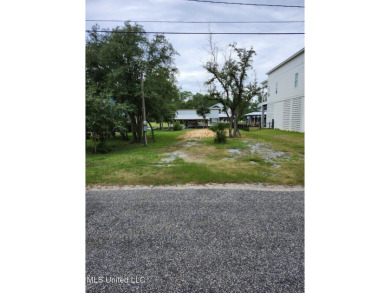 Enjoy this beautiful waterfront lot while planning your dream on Pass Christian Isles Golf Club in Mississippi - for sale on GolfHomes.com, golf home, golf lot