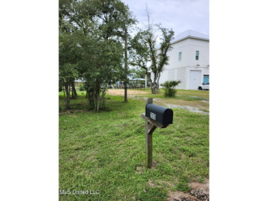 Enjoy this beautiful waterfront lot while planning your dream on Pass Christian Isles Golf Club in Mississippi - for sale on GolfHomes.com, golf home, golf lot