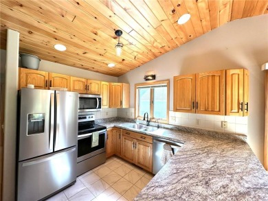 This impressive 3-bedroom, 2-bathroom home proudly overlooks the on Headwaters Country Club in Minnesota - for sale on GolfHomes.com, golf home, golf lot