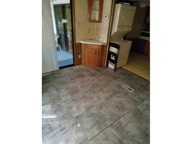 PRICED TO SELL!  Close to everything but far enough away for on Deer Creek RV Golf Resort in Florida - for sale on GolfHomes.com, golf home, golf lot