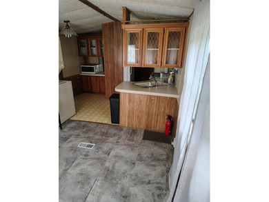 PRICED TO SELL!  Close to everything but far enough away for on Deer Creek RV Golf Resort in Florida - for sale on GolfHomes.com, golf home, golf lot