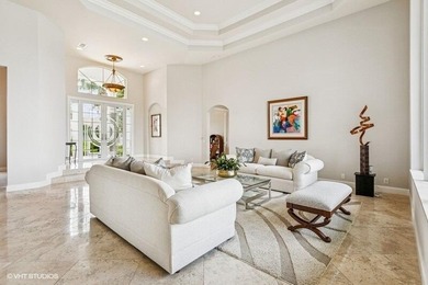 CUSTOM ESTATE HOME WITH 4BR PLUS OFFICE/4.1 BATHS LOCATED ON A on  in Florida - for sale on GolfHomes.com, golf home, golf lot