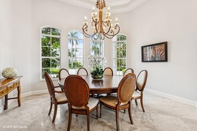 CUSTOM ESTATE HOME WITH 4BR PLUS OFFICE/4.1 BATHS LOCATED ON A on  in Florida - for sale on GolfHomes.com, golf home, golf lot