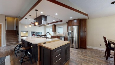 An extraordinary 5-bedroom, 6-bathroom unique tri-level home on Desert Hawk At Pueblo West in Colorado - for sale on GolfHomes.com, golf home, golf lot