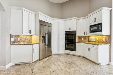 CUSTOM ESTATE HOME WITH 4BR PLUS OFFICE/4.1 BATHS LOCATED ON A on  in Florida - for sale on GolfHomes.com, golf home, golf lot