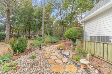 This beautiful home is nestled on a completely landscaped wooded on Lockwood Folly Country Club in North Carolina - for sale on GolfHomes.com, golf home, golf lot