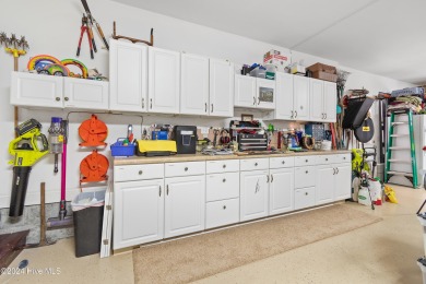 This beautiful home is nestled on a completely landscaped wooded on Lockwood Folly Country Club in North Carolina - for sale on GolfHomes.com, golf home, golf lot