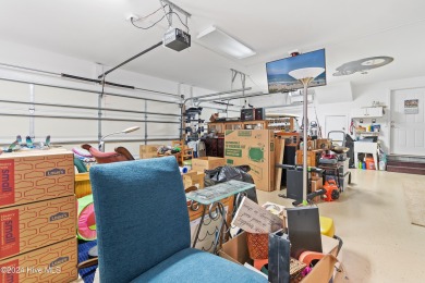 This beautiful home is nestled on a completely landscaped wooded on Lockwood Folly Country Club in North Carolina - for sale on GolfHomes.com, golf home, golf lot