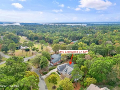 This beautiful home is nestled on a completely landscaped wooded on Lockwood Folly Country Club in North Carolina - for sale on GolfHomes.com, golf home, golf lot