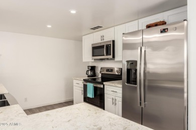 Start creating lasting memories in this charming end-unit on Painted Mountain Golf Club in Arizona - for sale on GolfHomes.com, golf home, golf lot