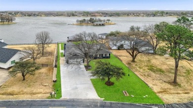 This stunningly reimagined lakeside retreat is a perfect fusion on Lake Kiowa Golf Course in Texas - for sale on GolfHomes.com, golf home, golf lot