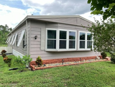 Beautiful and serene 2BR/2BA home with stunning golf course on Fairways Country Club in Florida - for sale on GolfHomes.com, golf home, golf lot