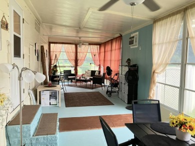 Beautiful and serene 2BR/2BA home with stunning golf course on Fairways Country Club in Florida - for sale on GolfHomes.com, golf home, golf lot